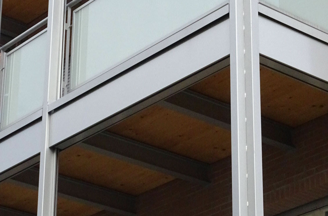 mattoni vista condominio vetro legno