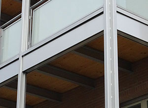 mattoni vista condominio vetro legno